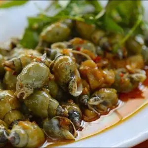 Ốc Cà Na Xào Me